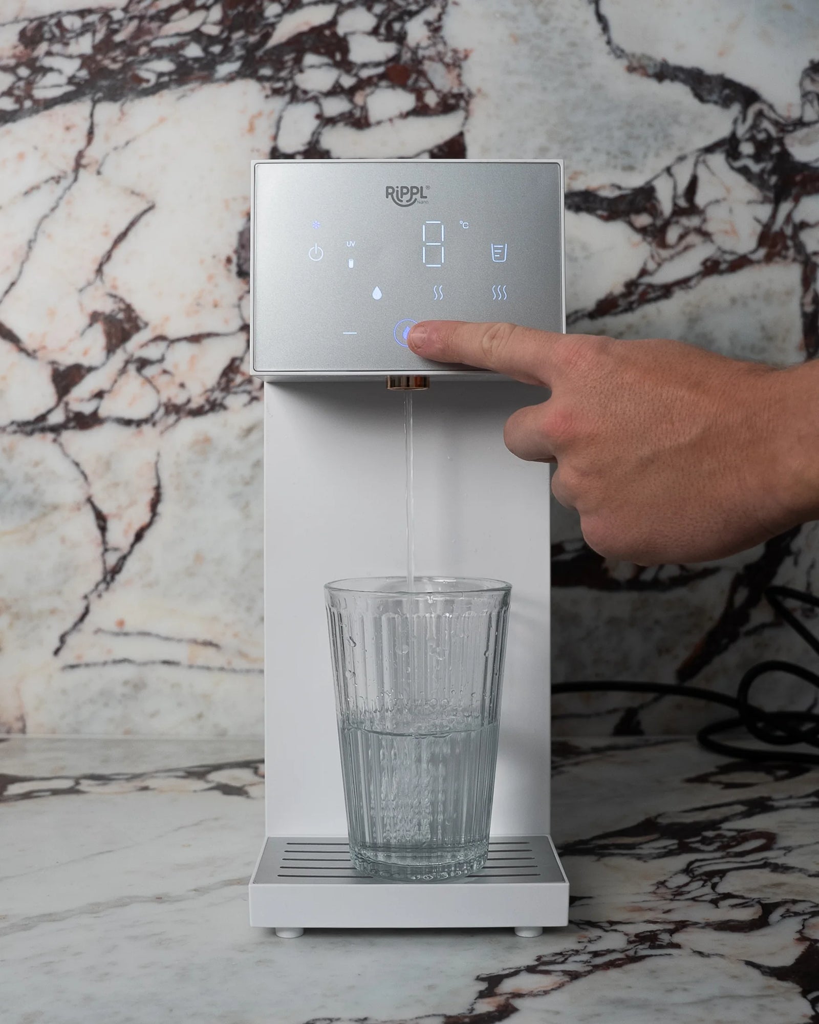 Rippl Nano pouring a glass of water