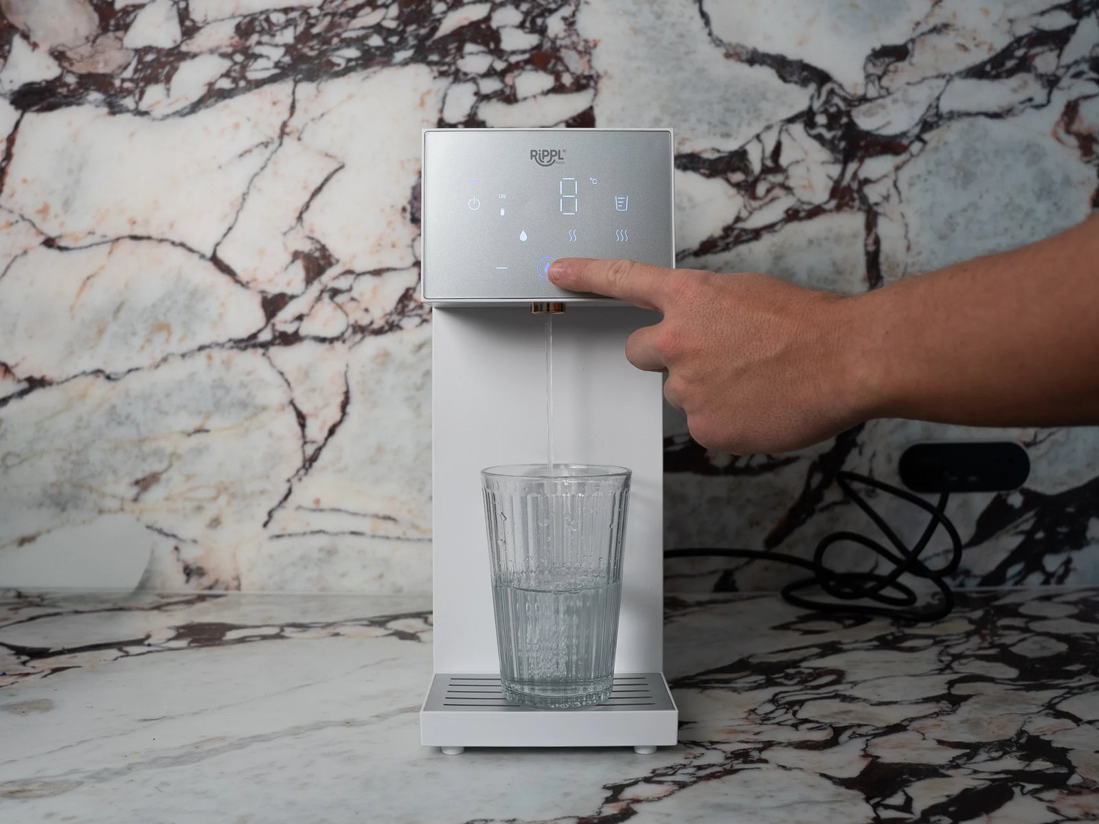 Rippl Nano pouring cold water into a glass