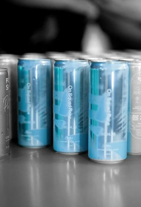On Squad Race cans lined up at the event