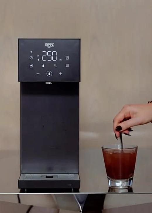 Rippl Nano in Black with a glass of iced tea