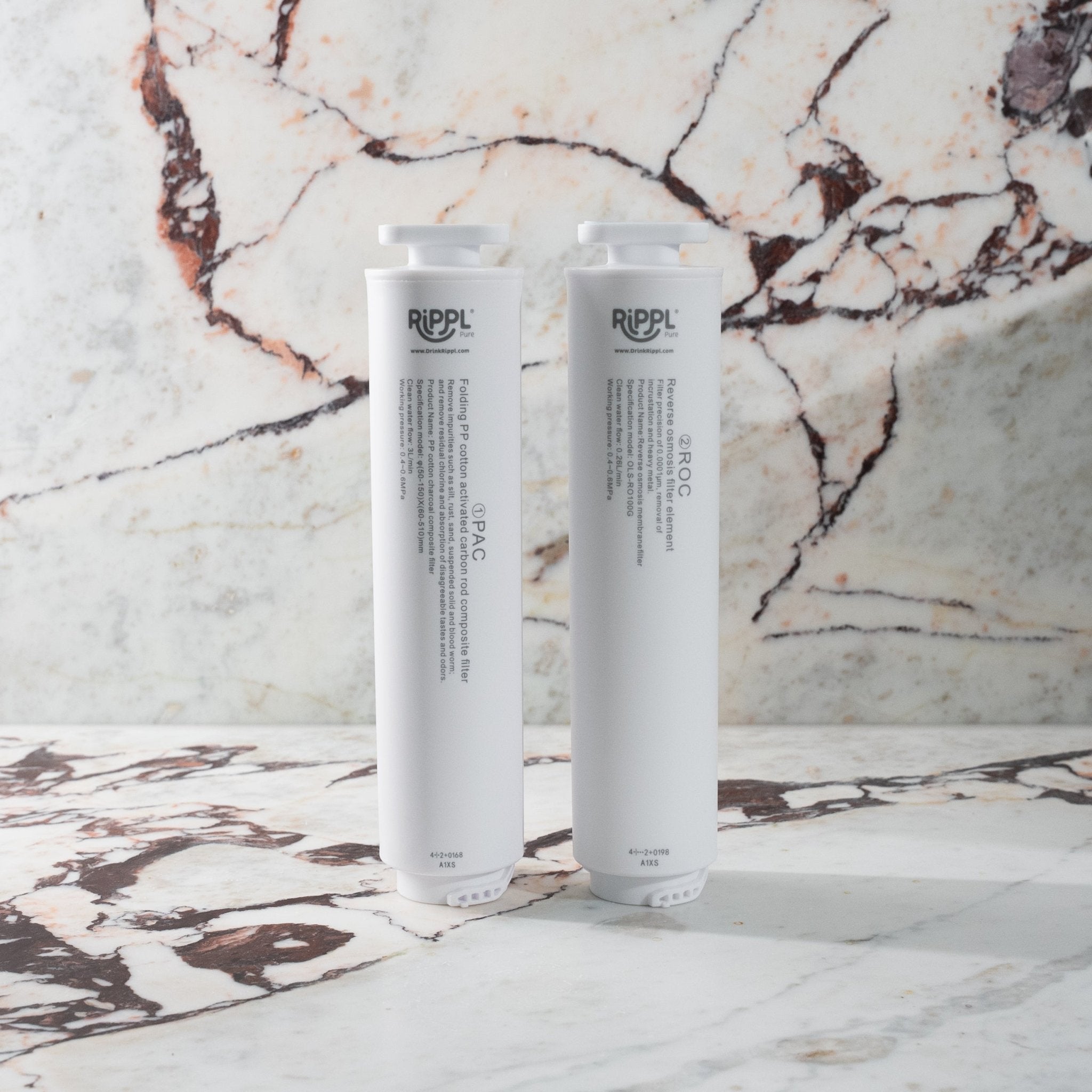 The Rippl Pure PAC filter and reverse osmosis filter standing on a marble bench