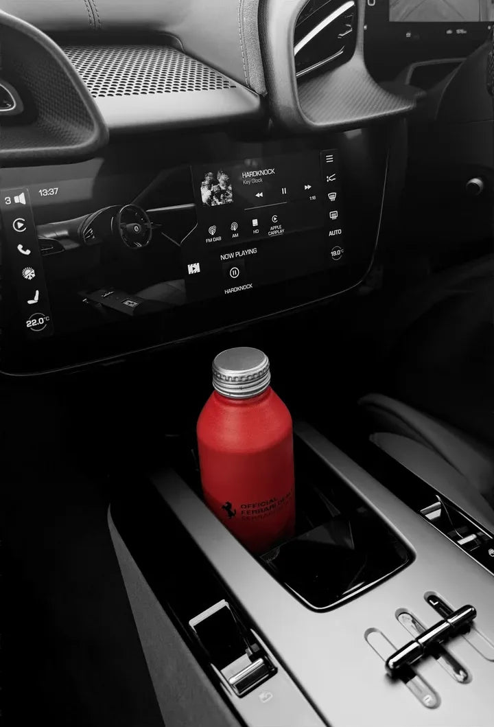 Ferrari aluminium bottle in a car